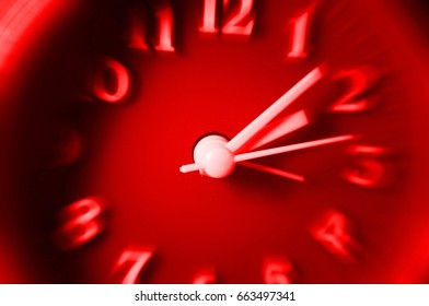 Red Clock With Speedy Blurred Effect. Concept Of Fast Time Passing.