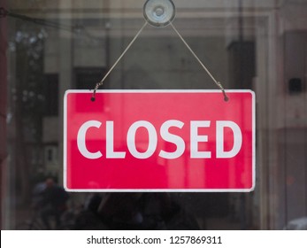 Red Closed Sign In A Shop Window