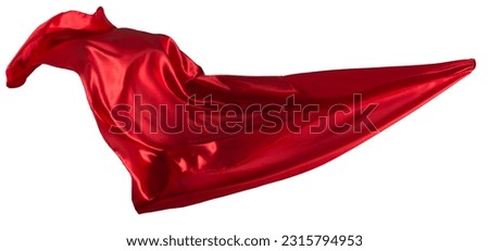 Red cloth flutters in the wind. Isolated on white background