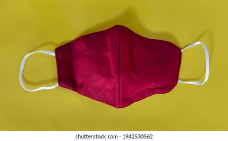 Red Cloth Mask On The Table