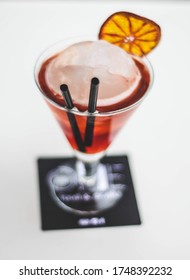 Red Cocktail With A Giant Ice Cube