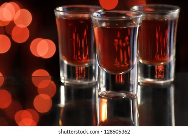 Red Cocktail In Shot Glasses