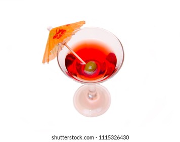 Red Cocktail With Umbrella On A White Background Seen From Above