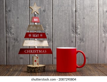 Red coffee cup with free space for your design. Christmas photo decoration with a cup for logo placement.