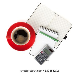 Red coffee cup and office supplies. View from above. Isolated on white background