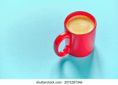 Red Coffee Cup On Blue Background With Free Space For Text