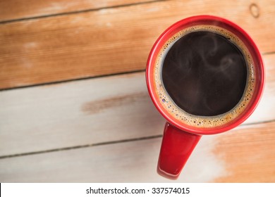 Red Coffee Cup On Wood Table