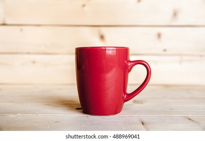 Red Coffee Cup On Wooden Table