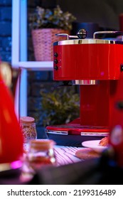 Red Coffee Machine On Kitchen Table Close Up