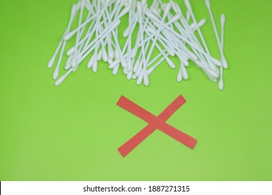 Red Color Cross Drawn In Front Of Cotton Buds To Raise Awareness For Ear Safety 