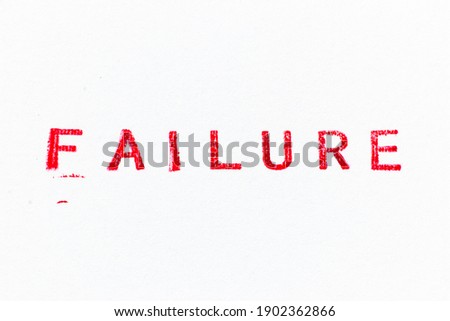 Red color failure word ink rubber stamp on white paper background