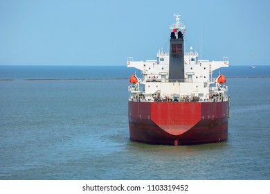 Red Color Oil Product Tanker At Anchor In The Port Of Houston.