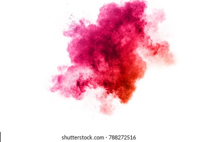 red color powder explosion on white background. Mauve red color cloud. red dust splash in the air. Freeze motion red color paint Holi.