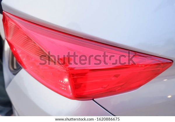 Red color of\
Taillight of the saloon\
car.