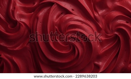 Red color velvet cream texture background. Closeup view.