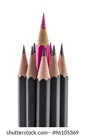 Red colored pencil jutting from a stack of black pencils, on white background