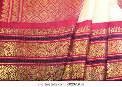 Red Colored Traditional Indian Silk Sari With Gold Border.