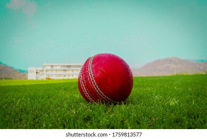 Red Colour Cricket Ball Green Grass