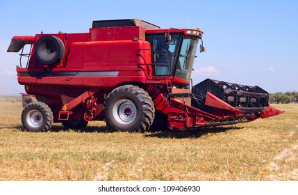 Red Combine On Field