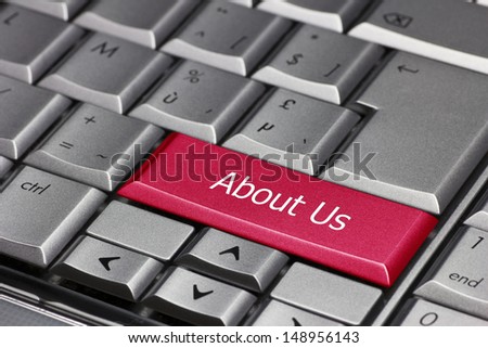 Red computer key saying 'About us' to get some more information