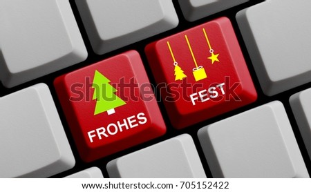 Red computer keyboard with fir tree and decoration showing Merry Christmas in german language