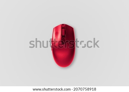 Red Computer mouse. The computer mouse on a white background. Concept of using computer items, remote work, homeoffice.