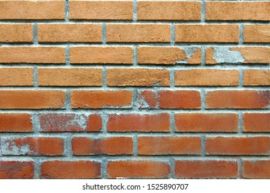 Red concrete brick wall with humidity damage - Image - Shutterstock ID 1525890707