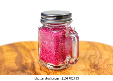 Red Confectionary Sugar In A Small Mason Jar