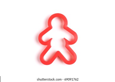 Red cookie cutter man isolated on a white background.