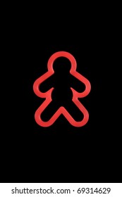 Red Cookie Cutter Man Isolated On A Black Background.