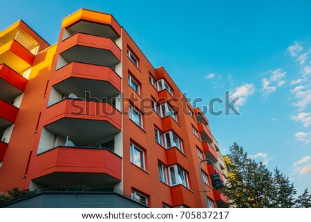red corner building with big balcony
