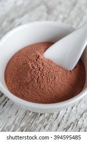 Red Cosmetic Clay Powder In A Small White Bowl  Close Up