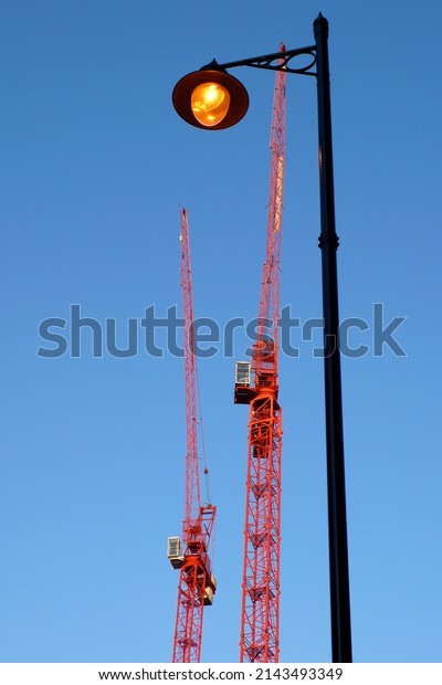 a red crane and old\
orange light bulb
