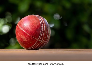 Red cricket ball

Close up of a used four piece leather cricket ball.