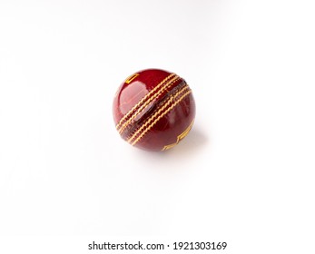 Red cricket ball isolated stock image.