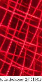 Red criss crossed neon light strips - bright neon texture background 