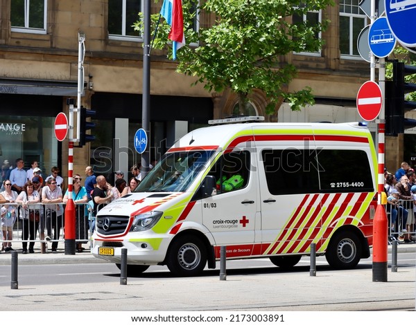 Red Cross emergency service\
van on National day parade. Luxembourg, Luxembourg - June 23,\
2022