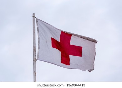 Red Cross on White Flag as first Aid Sign 