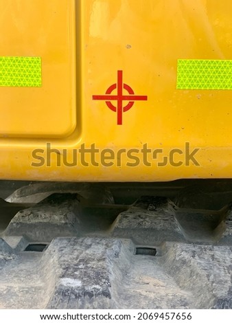 Red Crosshair Icon set Against a Yellow Industrial Equipment Background