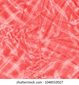 red crumpled synthetic textile background
