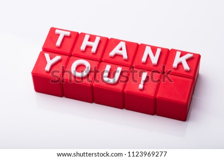 Red Cubic Blocks With Thank You Text On Reflective Background