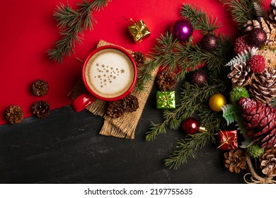 Red cup with Christmas coffee on a red background and latte coffee in neol decorations.  View from above