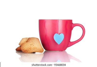 red cup with tea bag and heart-shaped cookies isolated on white - Powered by Shutterstock