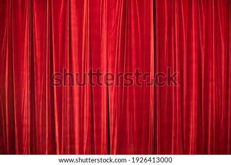 Red curtain in theatre. Textured background