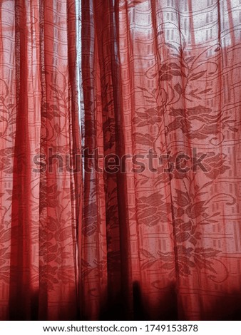 Space. Wallpaper with forest motif, in the mirror is reflected a red and white chequered curtain and a neon tube. Lost taste, in need of renovation.