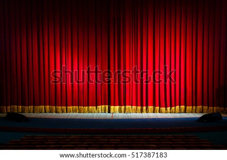 Red curtains in a theater scene of the show. Closed theater curtain of red velvet, texture, background.