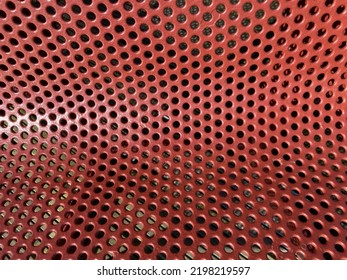 Red Curved Perforated Metal Sheet Close Up