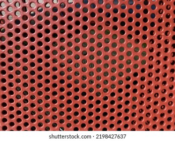 Red Curved Perforated Metal Sheet Close Up