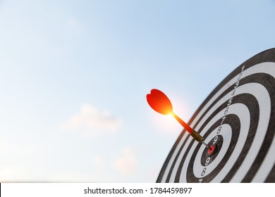 Red dart target arrow hitting on bullseye with,Target marketing and business success concept - Powered by Shutterstock