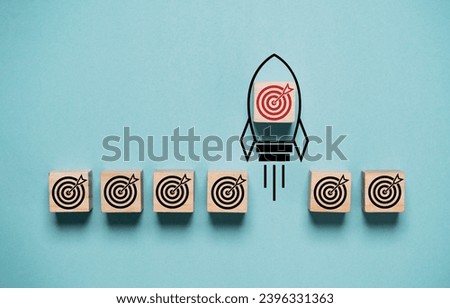 Red dartboard with arrow on rocket take off and move out from black dartboard for enhance and outstanding of business objective target goal concept. 